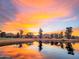Scenic sunset view over the pond at a beautiful golf course at 7155 E Oakmont Dr, Paradise Valley, AZ 85253