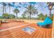 Outdoor terrace with a seating area, a hammock and a window floor, surrounded by palm trees at 7155 E Oakmont Dr, Paradise Valley, AZ 85253