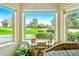 Bright window view overlooking the manicured golf course with lush green fairways and mature desert landscaping at 7155 E Oakmont Dr, Paradise Valley, AZ 85253