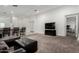 A neutral living area showcases an open floor plan leading to the kitchen and dining spaces at 7316 S 22Nd Ln, Phoenix, AZ 85041