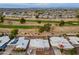 Aerial view of the neighborhood featuring lush golf course and desert landscaping at 10818 W Palmeras Dr, Sun City, AZ 85373