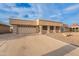 Charming single-story home featuring a clean desert landscape, paved driveway, and two-car garage at 10818 W Palmeras Dr, Sun City, AZ 85373