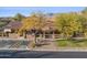 Aerial view of a clubhouse with accessible parking, covered porch, and desert landscaping at 11021 E Castle Dome Trl, Gold Canyon, AZ 85118