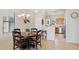 Cozy dining area featuring a chandelier and a view into the kitchen at 11021 E Castle Dome Trl, Gold Canyon, AZ 85118