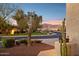 Home exterior featuring desert landscaping and scenic mountain views at 11021 E Castle Dome Trl, Gold Canyon, AZ 85118