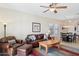 Inviting living room with leather furniture, a ceiling fan, and a decorative rug at 11021 E Castle Dome Trl, Gold Canyon, AZ 85118