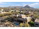 Luxury home with beautiful mountain views, mature landscaping, pool, and desert landscape at 11082 E Mark Ln, Scottsdale, AZ 85262