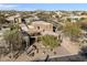 Desert home showcasing landscaped yard, beautiful desert surroundings, and mountain views at 11082 E Mark Ln, Scottsdale, AZ 85262