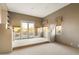 Spacious bedroom with balcony access and neutral tones, providing a serene and inviting atmosphere at 11082 E Mark Ln, Scottsdale, AZ 85262