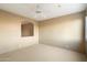 Bright room features plush carpet, neutral tones, and seamless flow to adjoining spaces at 11082 E Mark Ln, Scottsdale, AZ 85262
