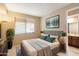 Inviting carpeted bedroom with attached bath features an open window providing ample natural light at 11082 E Mark Ln, Scottsdale, AZ 85262