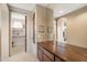 Walk-in closet with a built-in dresser and access to additional storage, designed for organization at 11082 E Mark Ln, Scottsdale, AZ 85262