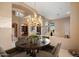 Formal dining room featuring a decorative chandelier and an inviting space for gathering and entertaining at 11082 E Mark Ln, Scottsdale, AZ 85262