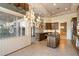 View of kitchen and dining area with tile flooring and natural light at 11082 E Mark Ln, Scottsdale, AZ 85262