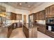 Well-equipped kitchen with granite countertops, tile floors and stainless steel appliances at 11082 E Mark Ln, Scottsdale, AZ 85262