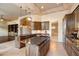 Open concept kitchen with granite countertops, kitchen island and tile flooring at 11082 E Mark Ln, Scottsdale, AZ 85262