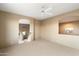 Inviting room featuring neutral tones, plush carpeting, and seamless flow to adjoining spaces at 11082 E Mark Ln, Scottsdale, AZ 85262