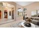 Bright living room with large windows, stylish furnishings, and elegant decor create a welcoming atmosphere at 11082 E Mark Ln, Scottsdale, AZ 85262