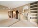 Open living area with plush carpet, a ceiling fan, and seamless access to other rooms at 11082 E Mark Ln, Scottsdale, AZ 85262