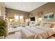 Main bedroom with plush carpet, accent lighting, and balcony access at 11082 E Mark Ln, Scottsdale, AZ 85262