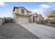 Charming front exterior showcasing a two-story home, two car garage, and a long private driveway at 11451 E Starkey Ave, Mesa, AZ 85212