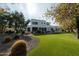 Expansive backyard with lush green grass, a modern home, and stylish outdoor seating, perfect for entertaining and relaxation at 11745 N 99Th St, Scottsdale, AZ 85260