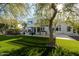Inviting backyard featuring a modern home, outdoor dining area, and lush landscaping, perfect for outdoor gatherings and enjoyment at 11745 N 99Th St, Scottsdale, AZ 85260
