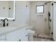 Modern bathroom featuring a glass-enclosed shower, sleek fixtures, and contemporary design elements at 11745 N 99Th St, Scottsdale, AZ 85260