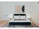 Minimalist bedroom with a comfortable bed, simple decor, and cozy lighting at 11745 N 99Th St, Scottsdale, AZ 85260
