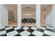 Open dining room with stunning light fixtures and elegant wine cellar at 11745 N 99Th St, Scottsdale, AZ 85260