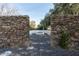Charming outdoor firepit area with stone walls and comfortable seating, perfect for cozy evenings and gatherings at 11745 N 99Th St, Scottsdale, AZ 85260