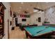 Spacious game room with a pool table and comfortable seating area at 11745 N 99Th St, Scottsdale, AZ 85260