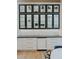 Kitchen cabinets with glass doors and white countertops offer both style and plenty of storage space at 11745 N 99Th St, Scottsdale, AZ 85260