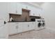 Well-organized laundry room with ample storage, modern appliances, and a practical layout at 11745 N 99Th St, Scottsdale, AZ 85260