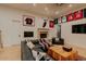 Inviting living room with fireplace and curated sports memorabilia display at 11745 N 99Th St, Scottsdale, AZ 85260