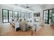Bright living room with hardwood floors, fireplace, coffered ceilings and floor-to-ceiling windows at 11745 N 99Th St, Scottsdale, AZ 85260