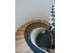 Unique spiral staircase with wooden steps and decorative railing next to piano at 11745 N 99Th St, Scottsdale, AZ 85260