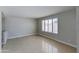 Neutral bedroom featuring tile floors, a large window, and a blank canvas for personalization at 1206 E Greenway Dr, Tempe, AZ 85282