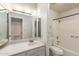 Bathroom featuring a vanity, a large mirror, and a shower and tub combo for all your bathing needs at 1221 E Palacio Dr, Phoenix, AZ 85014