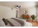 A neutral bedroom featuring light-colored walls, wooden floors, a bed, and decor at 1221 E Palacio Dr, Phoenix, AZ 85014