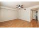 Well-lit bedroom featuring a ceiling fan and hardwood floors, providing a comfortable and inviting space at 1221 E Palacio Dr, Phoenix, AZ 85014