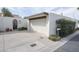 Detached two-car garage with driveway and mature landscaping for privacy at 1221 E Palacio Dr, Phoenix, AZ 85014