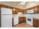 Functional kitchen with oak cabinets and white appliances at 1221 E Palacio Dr, Phoenix, AZ 85014
