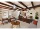 Open-concept living room with hardwood floors, neutral colors, fireplace and dining room at 1221 E Palacio Dr, Phoenix, AZ 85014