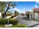 Residential street lined with lush landscaping, mature trees, and well-maintained homes in a serene neighborhood at 1221 E Palacio Dr, Phoenix, AZ 85014
