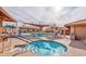 Community pool features a spa, covered seating, and lounge chairs for relaxing by the water at 1222 Leisure World --, Mesa, AZ 85206