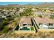 Expansive aerial view of luxury property showcasing private pool and desert landscaping at 12245 E Clinton St, Scottsdale, AZ 85259