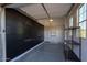Well-organized garage with slat wall, epoxy floor, storage cabinets, and natural light at 12245 E Clinton St, Scottsdale, AZ 85259
