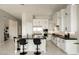 Bright open kitchen with a large island and modern stainless steel appliances at 12245 E Clinton St, Scottsdale, AZ 85259