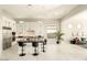 Spacious kitchen with an island, white cabinetry, and stainless steel appliances at 12245 E Clinton St, Scottsdale, AZ 85259